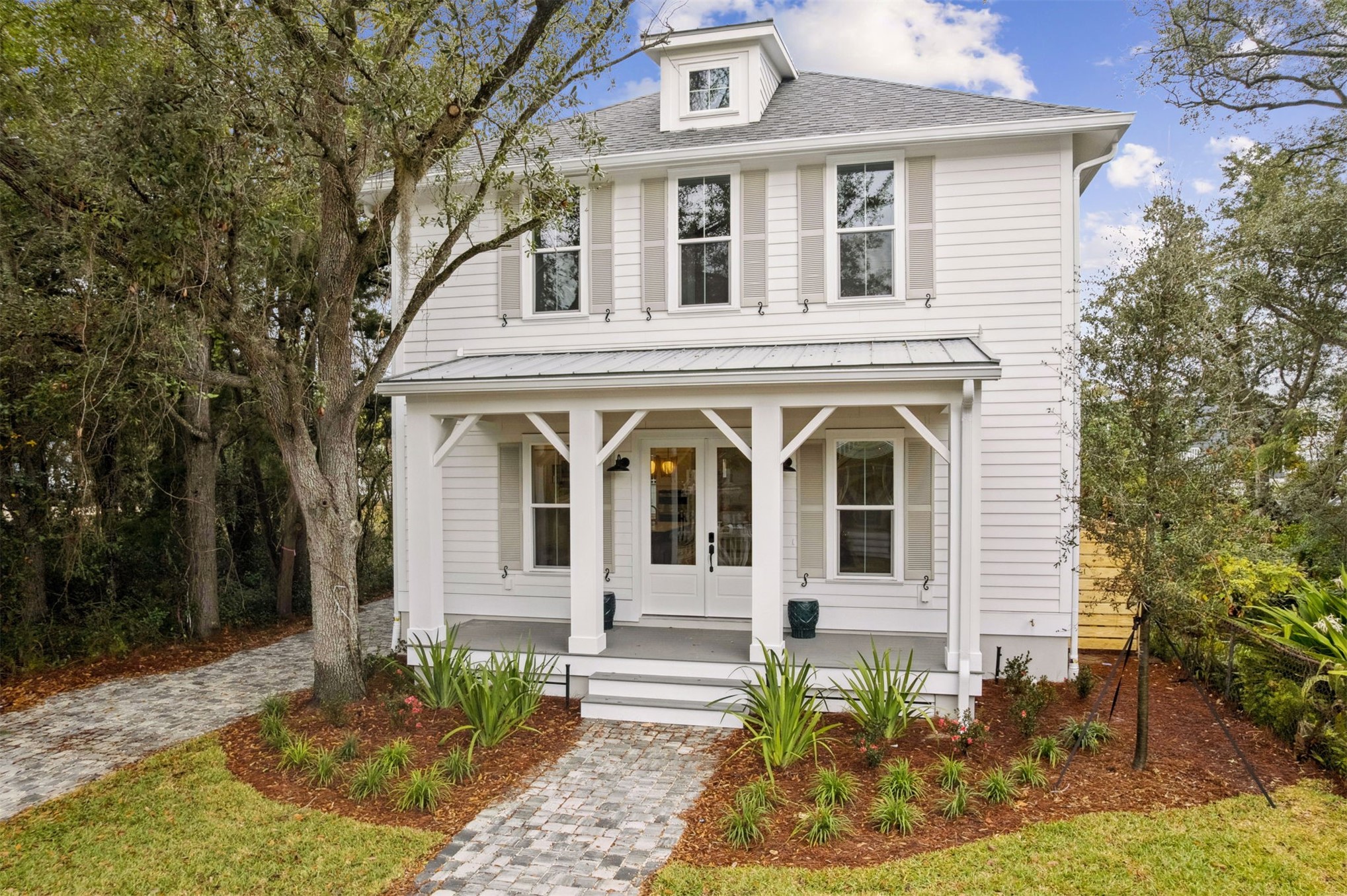 front view of a house with a yard