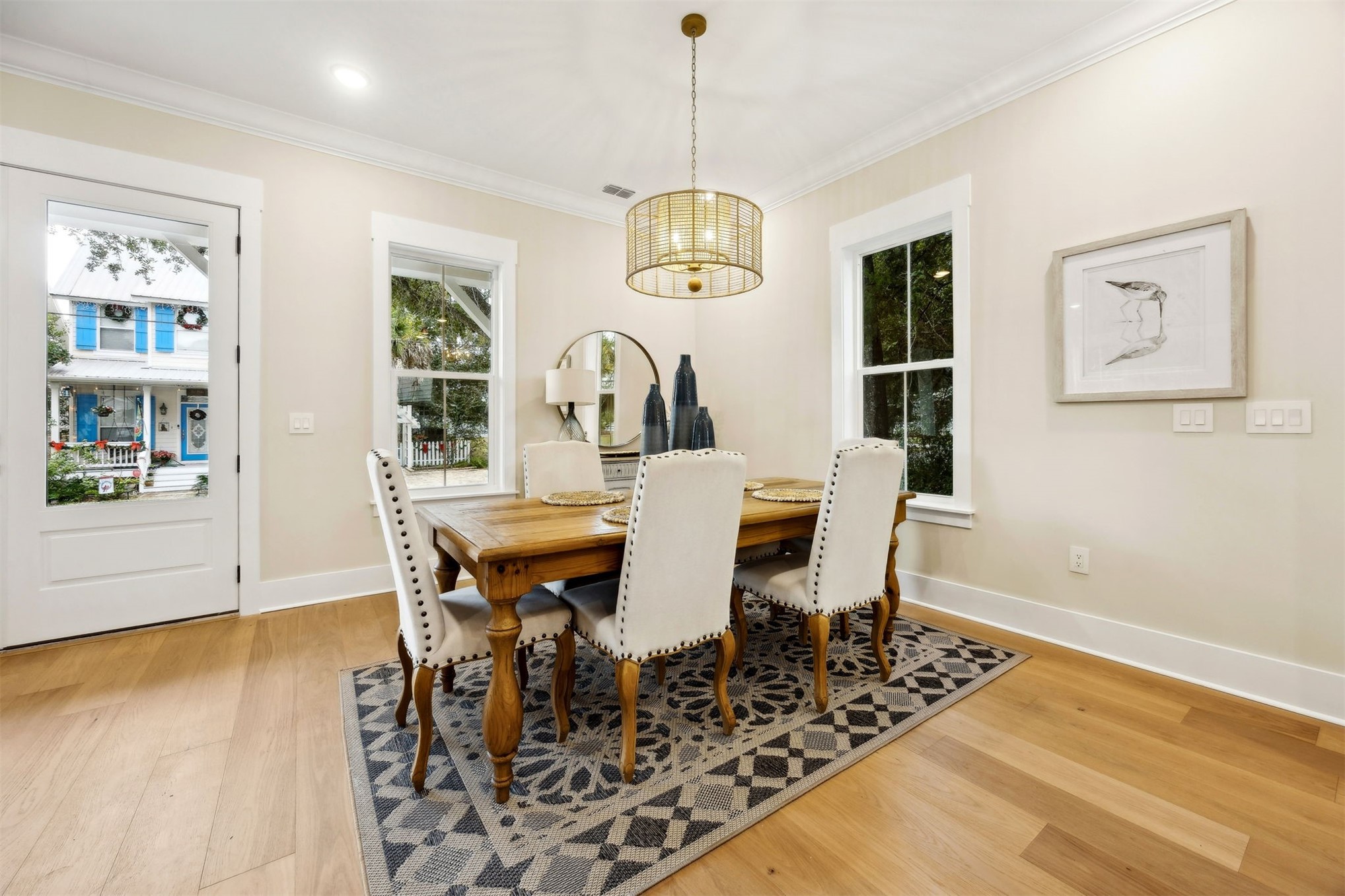 1111 White Street Fernandina Beach, FL 32034 - Photo 12 of 82 a view of a dining room with furniture wooden floor and chandelier