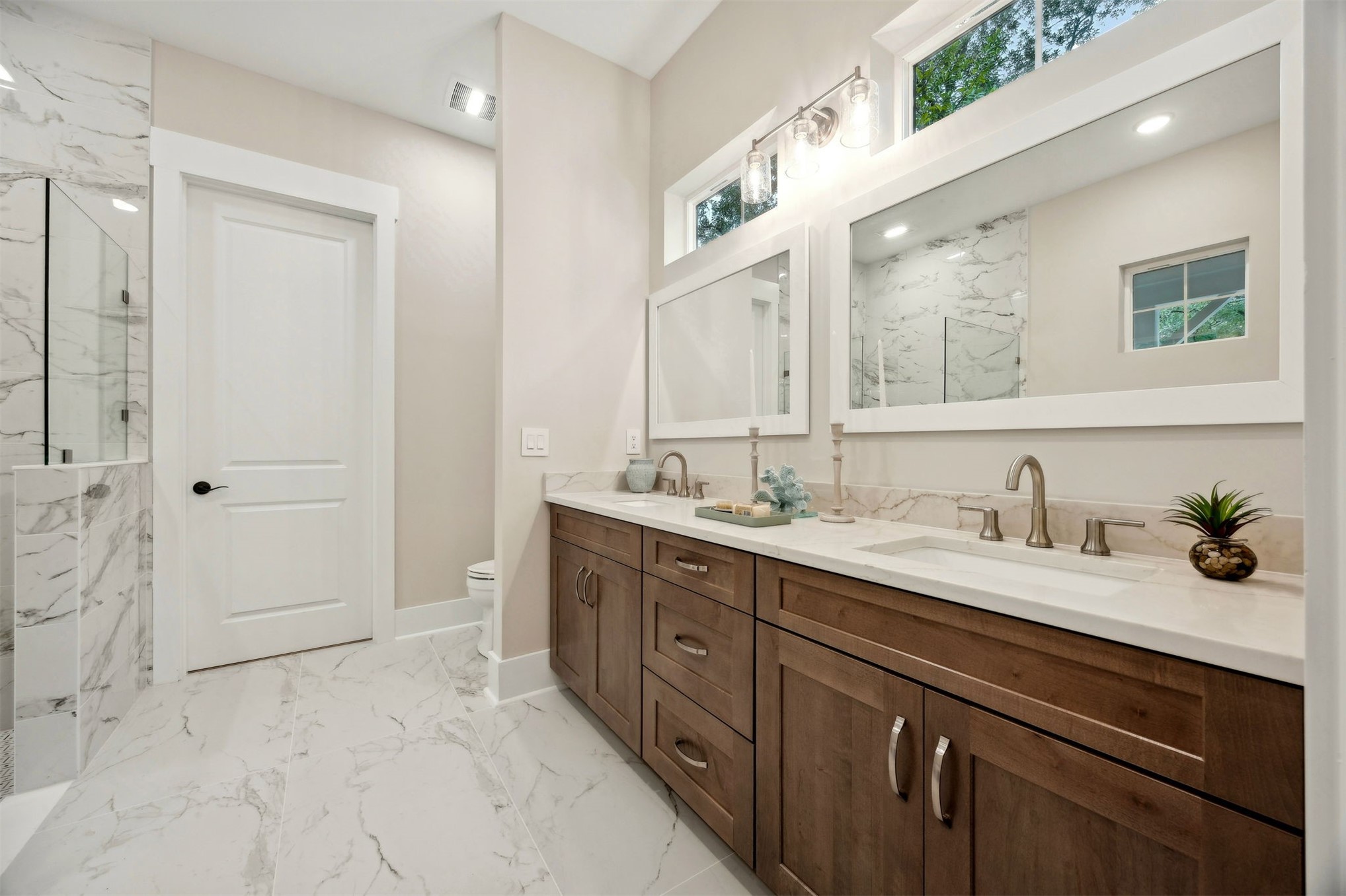 1111 White Street Fernandina Beach, FL 32034 - Photo 25 of 82 a spacious bathroom with a granite countertop sink mirror and double