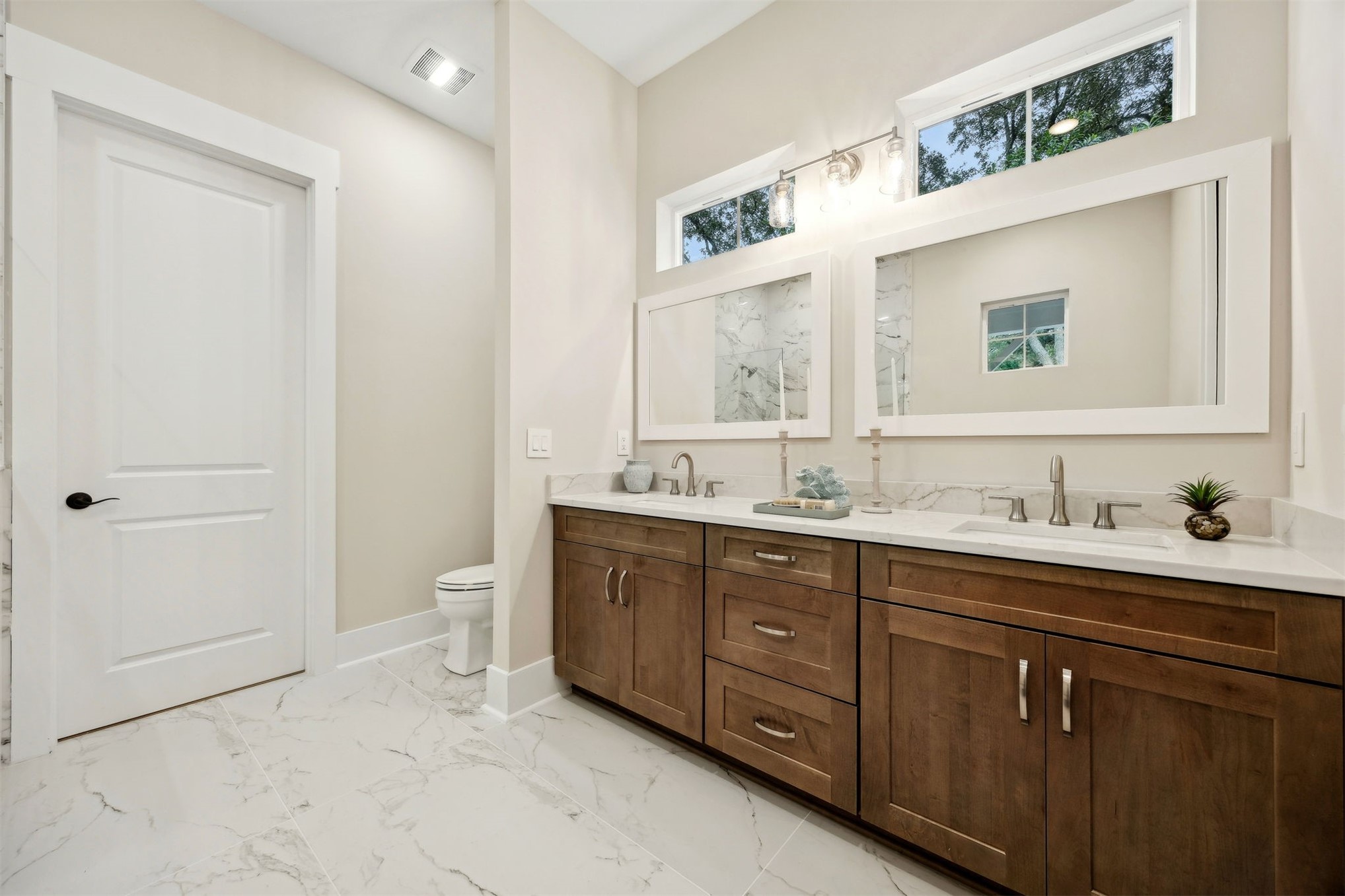 1111 White Street Fernandina Beach, FL 32034 - Photo 29 of 82 a bathroom with a granite countertop sink and a mirror