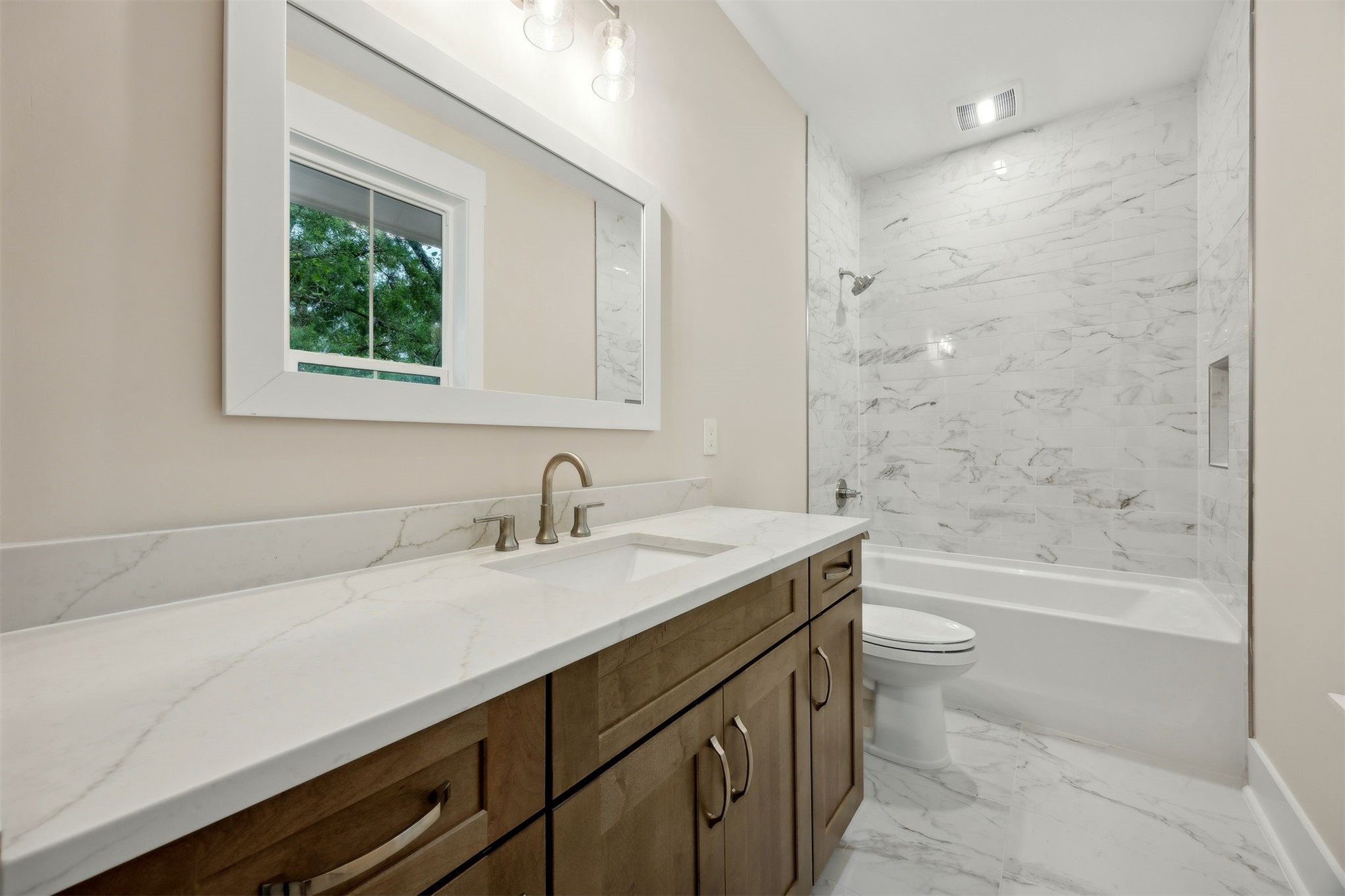 1111 White Street Fernandina Beach, FL 32034 - Photo 43 of 82 a bathroom with a sink a toilet and shower