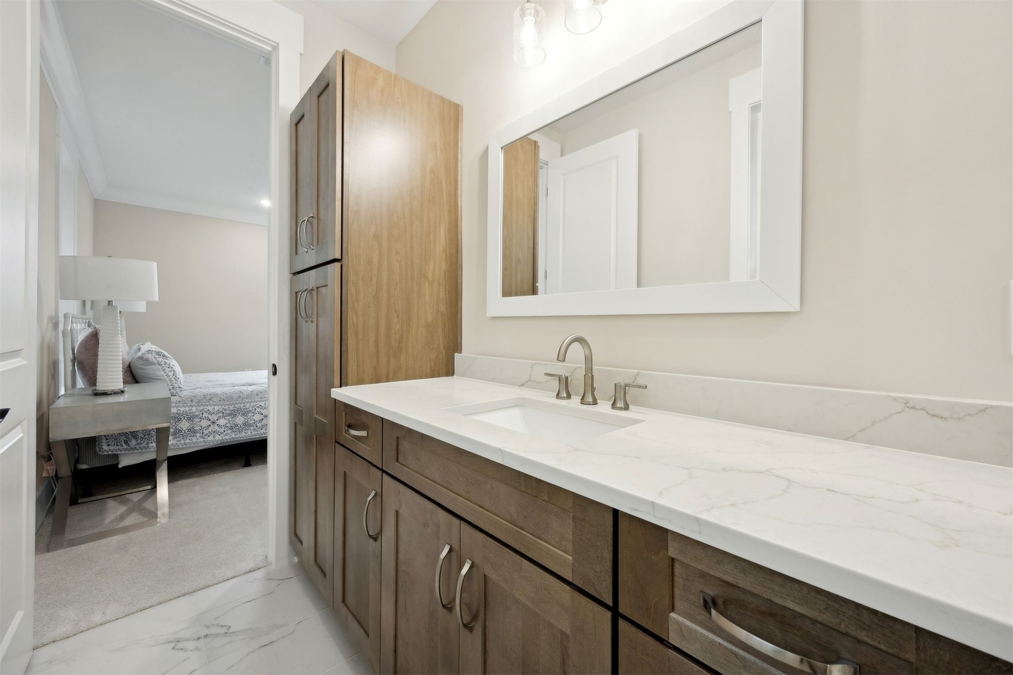 1111 White Street Fernandina Beach, FL 32034 - Photo 44 of 82 a en suite bathroom with a sink and a mirror