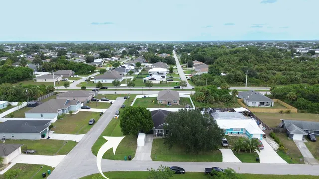 an aerial view of residential houses with outdoor space