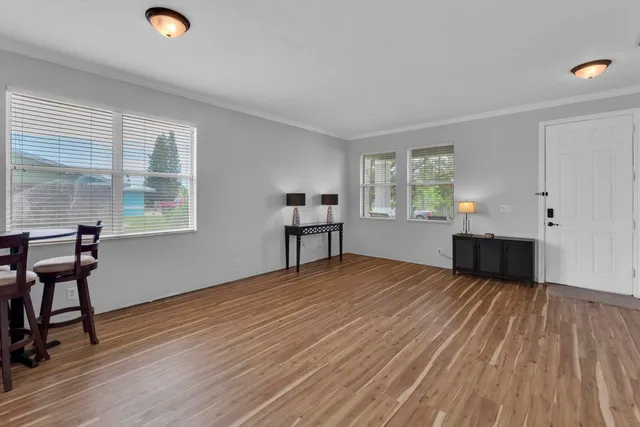 a view of a livingroom with furniture and wooden floor
