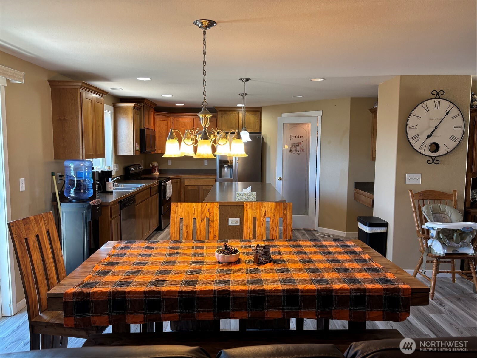 909 Polo Ridge Moses Lake, WA 98837 - Photo 21 of 27 a large dining space with furniture window and wooden floor