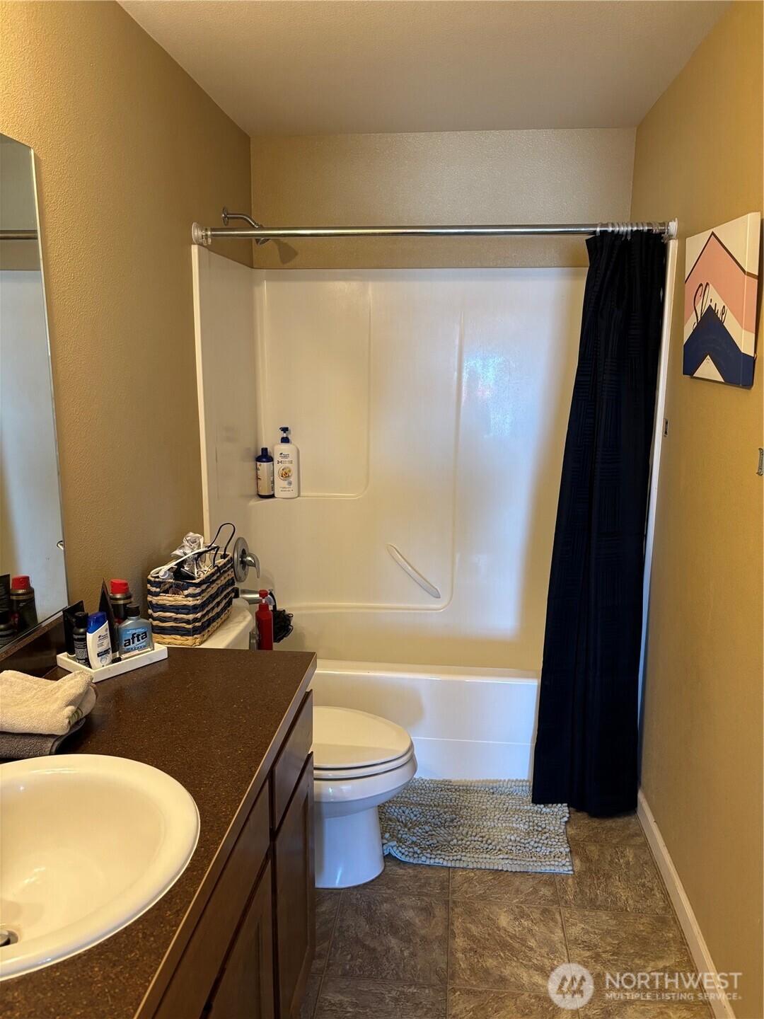 909 Polo Ridge Moses Lake, WA 98837 - Photo 8 of 27 a bathroom with a sink toilet and shower