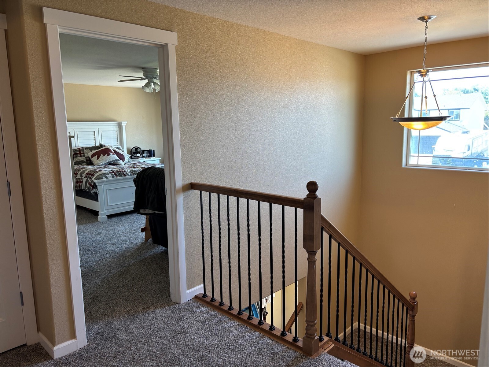 909 Polo Ridge Moses Lake, WA 98837 - Photo 9 of 27 a view of a hallway to a livingroom with furniture