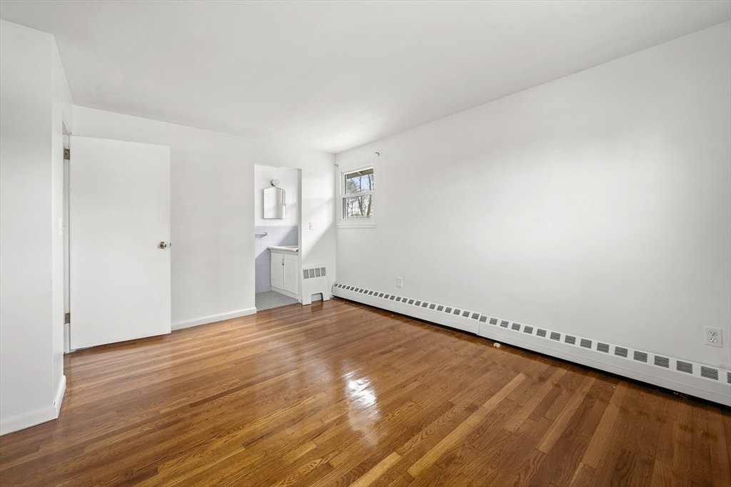 276 Oak Street Brockton, MA 02301 - Photo 22 of 42 a view of a room with wooden floor and window