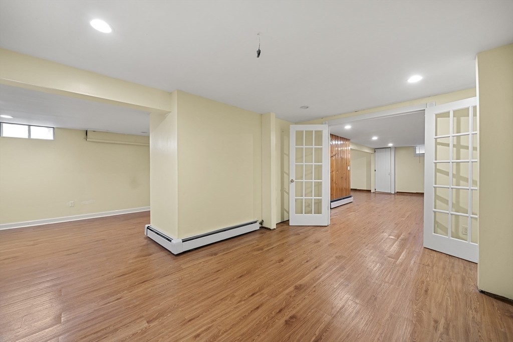 276 Oak Street Brockton, MA 02301 - Photo 25 of 42 a view of an empty room with wooden floor