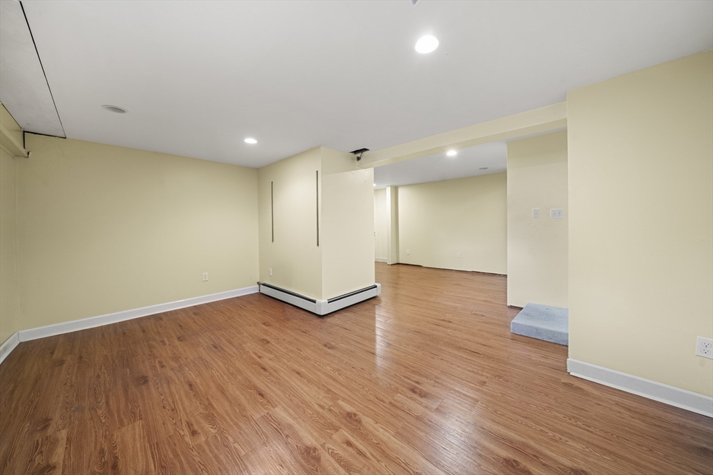 276 Oak Street Brockton, MA 02301 - Photo 26 of 42 a view of an empty room with wooden floor
