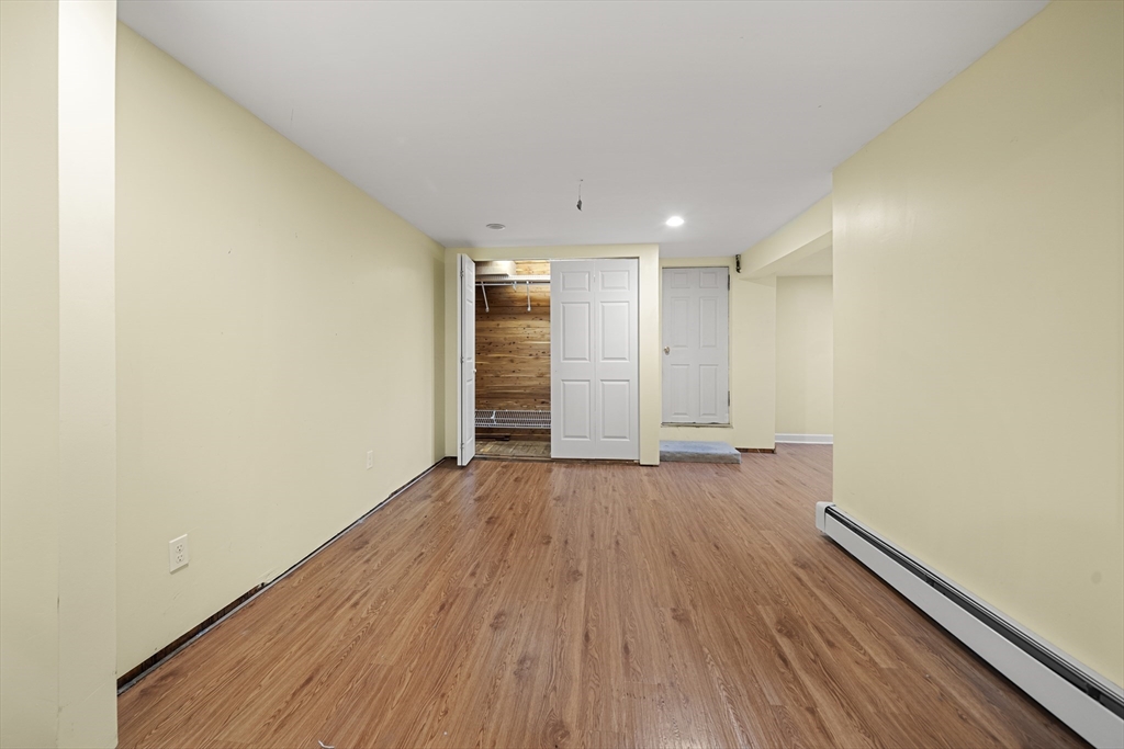 276 Oak Street Brockton, MA 02301 - Photo 29 of 42 a view of empty room with wooden floor