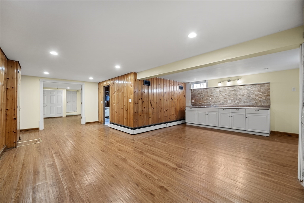 276 Oak Street Brockton, MA 02301 - Photo 33 of 42 a view of an empty room with wooden floor
