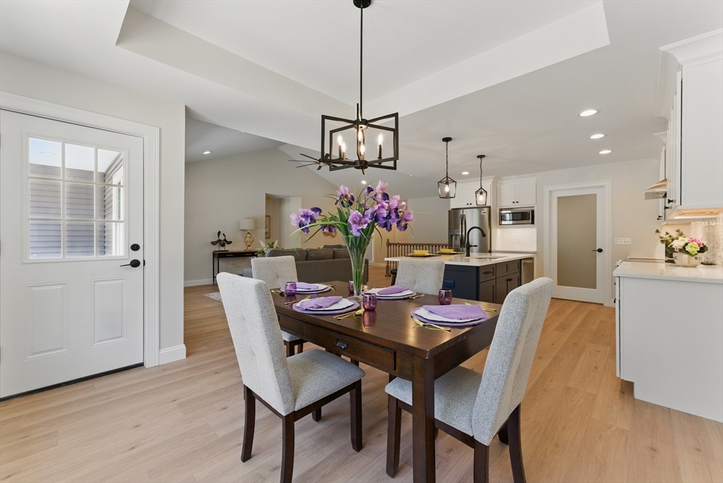 18 Nicols Way, Unit 18 Easthampton, MA 01027 - Photo 14 of 40 a view of a dining room with furniture window and wooden floor