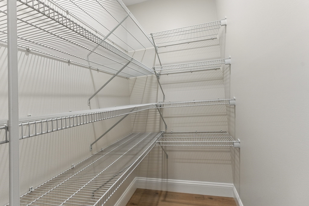 18 Nicols Way, Unit 18 Easthampton, MA 01027 - Photo 16 of 40 a view of walk in closet with empty racks