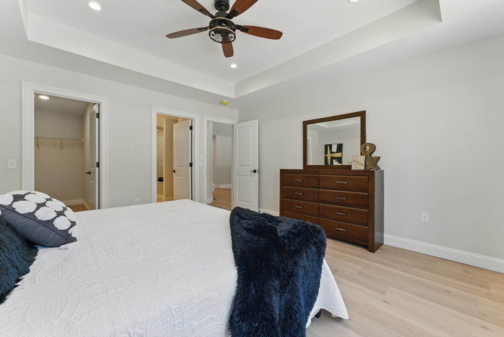 18 Nicols Way, Unit 18 Easthampton, MA 01027 - Photo 19 of 40 a bedroom with a bed and cabinet