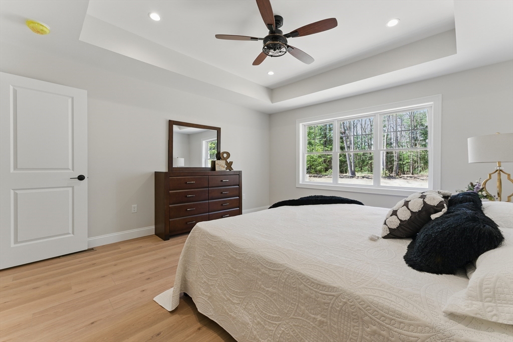 18 Nicols Way, Unit 18 Easthampton, MA 01027 - Photo 20 of 40 a bedroom with a bed dresser and a window