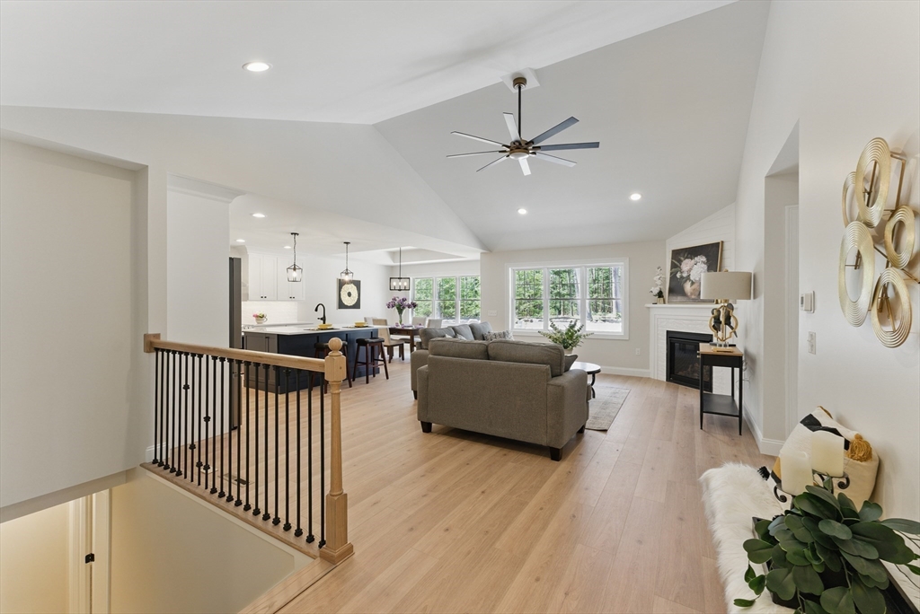 18 Nicols Way, Unit 18 Easthampton, MA 01027 - Photo 2 of 40 a living room with furniture kitchen view and a wooden floor
