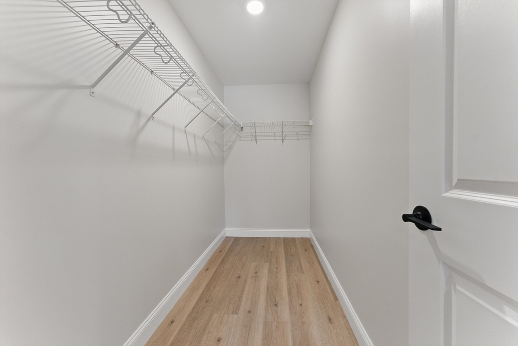 18 Nicols Way, Unit 18 Easthampton, MA 01027 - Photo 23 of 40 a view of a room with wooden floor