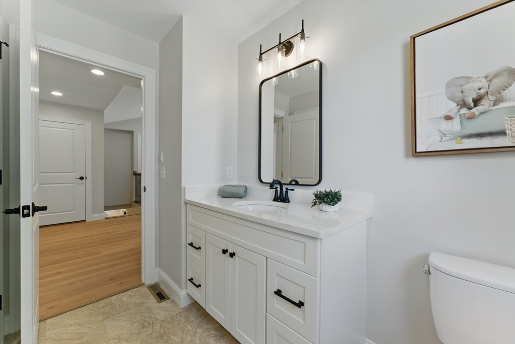 18 Nicols Way, Unit 18 Easthampton, MA 01027 - Photo 30 of 40 a bathroom with a double vanity sink and a mirror