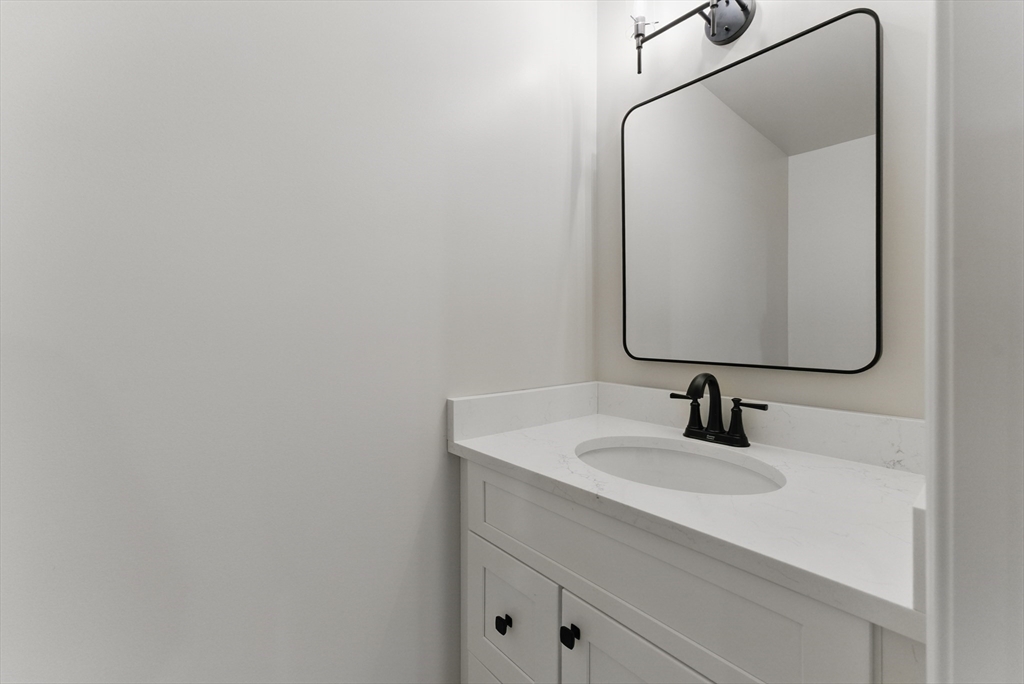 18 Nicols Way, Unit 18 Easthampton, MA 01027 - Photo 34 of 40 a bathroom with a sink and a mirror