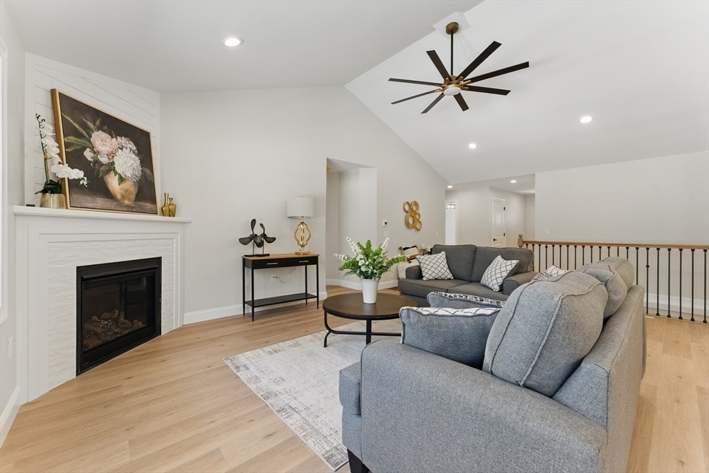 18 Nicols Way, Unit 18 Easthampton, MA 01027 - Photo 6 of 40 a living room with furniture and a fireplace