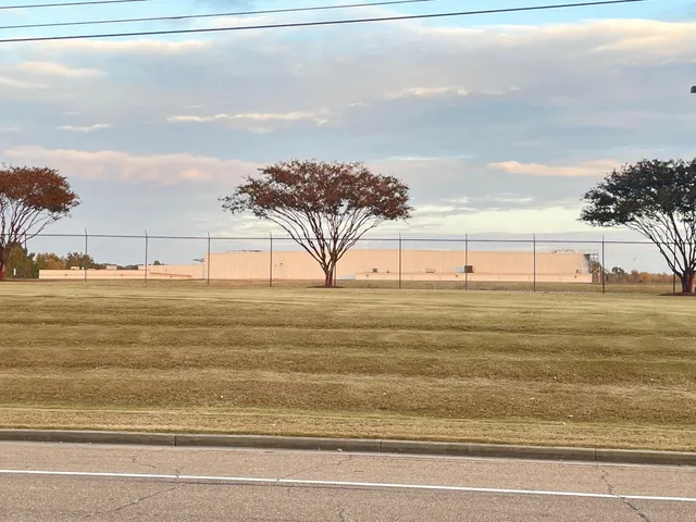 a view of a swimming pool and a yard