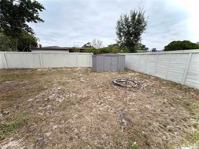 a backyard of a house with lots of green space
