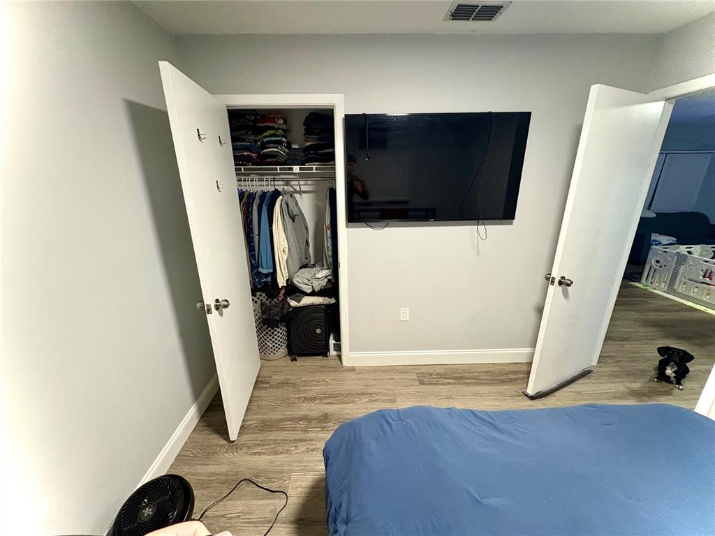 8501 Paxton Drive Port Richey, FL 34668 - Photo 8 of 17 a view of walk in closet with clothes and shoes