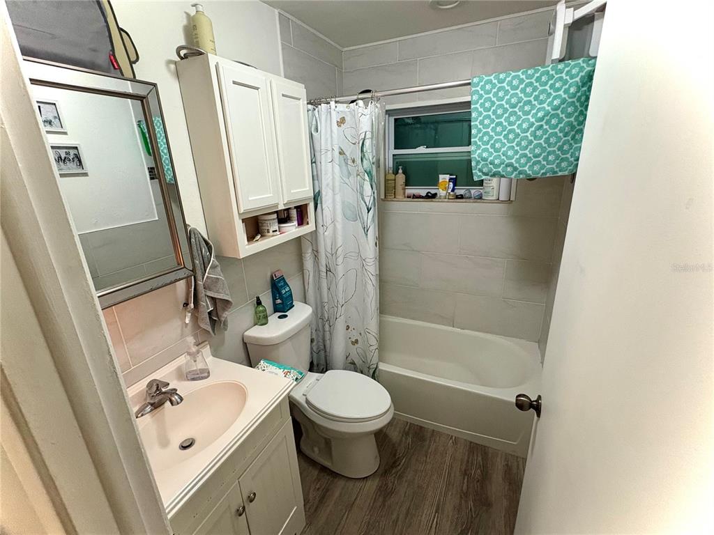 8501 Paxton Drive Port Richey, FL 34668 - Photo 9 of 17 a bathroom with a sink a toilet and shower