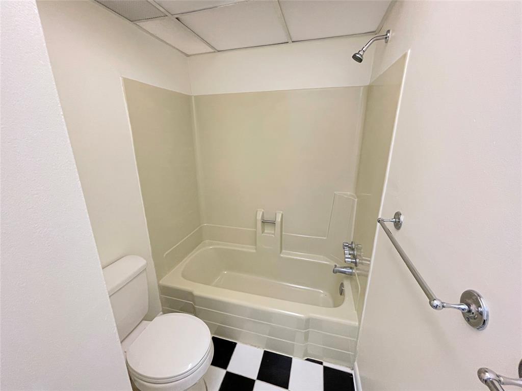 2800 Northwest 56th Avenue, Unit F403 Lauderhill, FL 33313 - Photo 8 of 11 a bathroom with a bathtub and a toilet