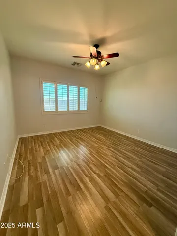a bathroom with a sink mirror and shower