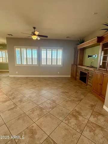 a kitchen with kitchen island granite countertop a stove a sink and a refrigerator