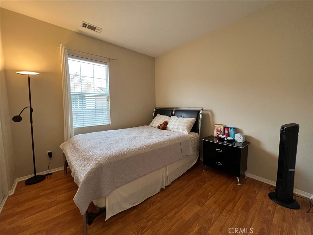 10 Chilmark Street Ladera Ranch, CA 92694 - Photo 11 of 16 a bedroom with a bed and a flat screen tv
