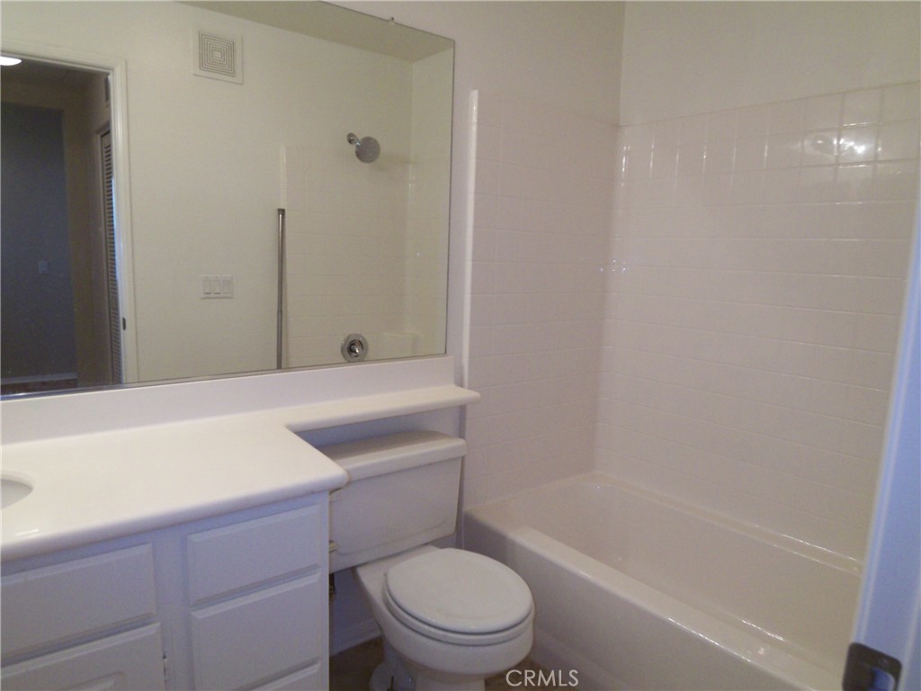 10 Chilmark Street Ladera Ranch, CA 92694 - Photo 12 of 16 a bathroom with a toilet and a bathtub
