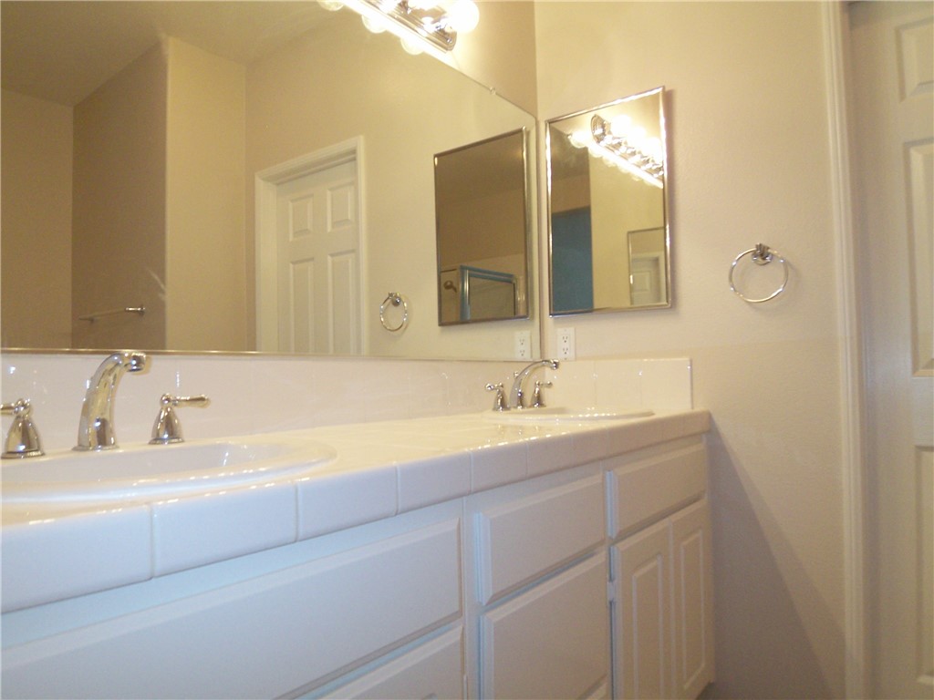 10 Chilmark Street Ladera Ranch, CA 92694 - Photo 8 of 16 a bathroom with a sink and a mirror