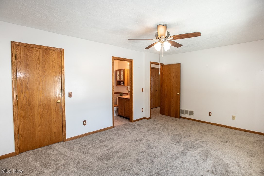 2624 Lester Road Medina, OH 44256 - Photo 22 of 50 Primary Bedroom with newer carpet and large walk closet