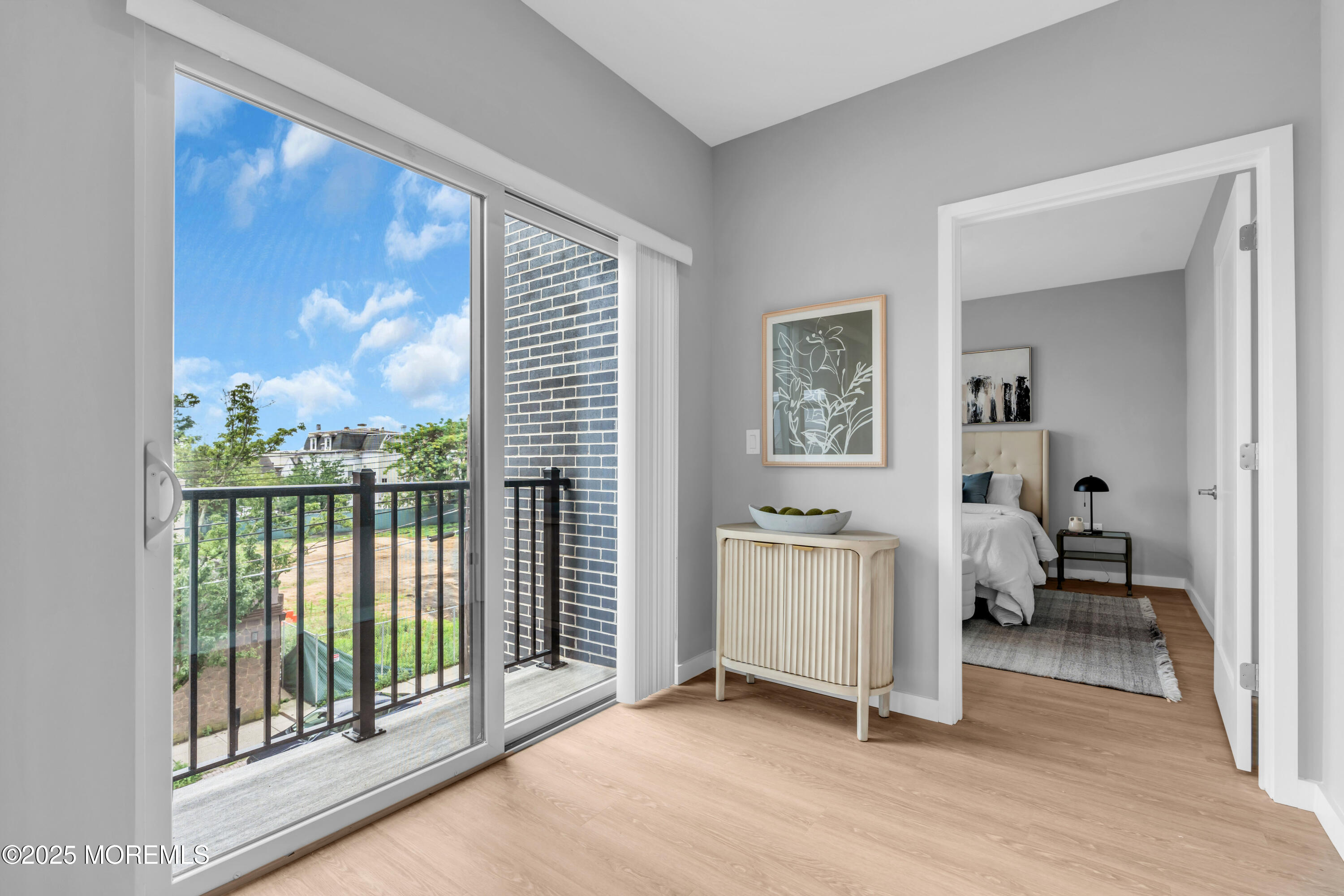 120 Monmouth Street, Unit 210 Red Bank, NJ 07701 - Photo 13 of 37 a view of a room with gym equipment and floor to ceiling window