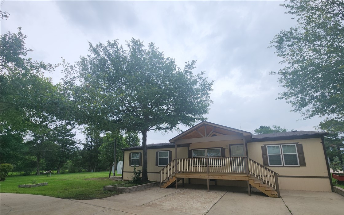 3738 Smetana Road Bryan, TX 77807 - Photo 1 of 29 a front view of a house with a garden