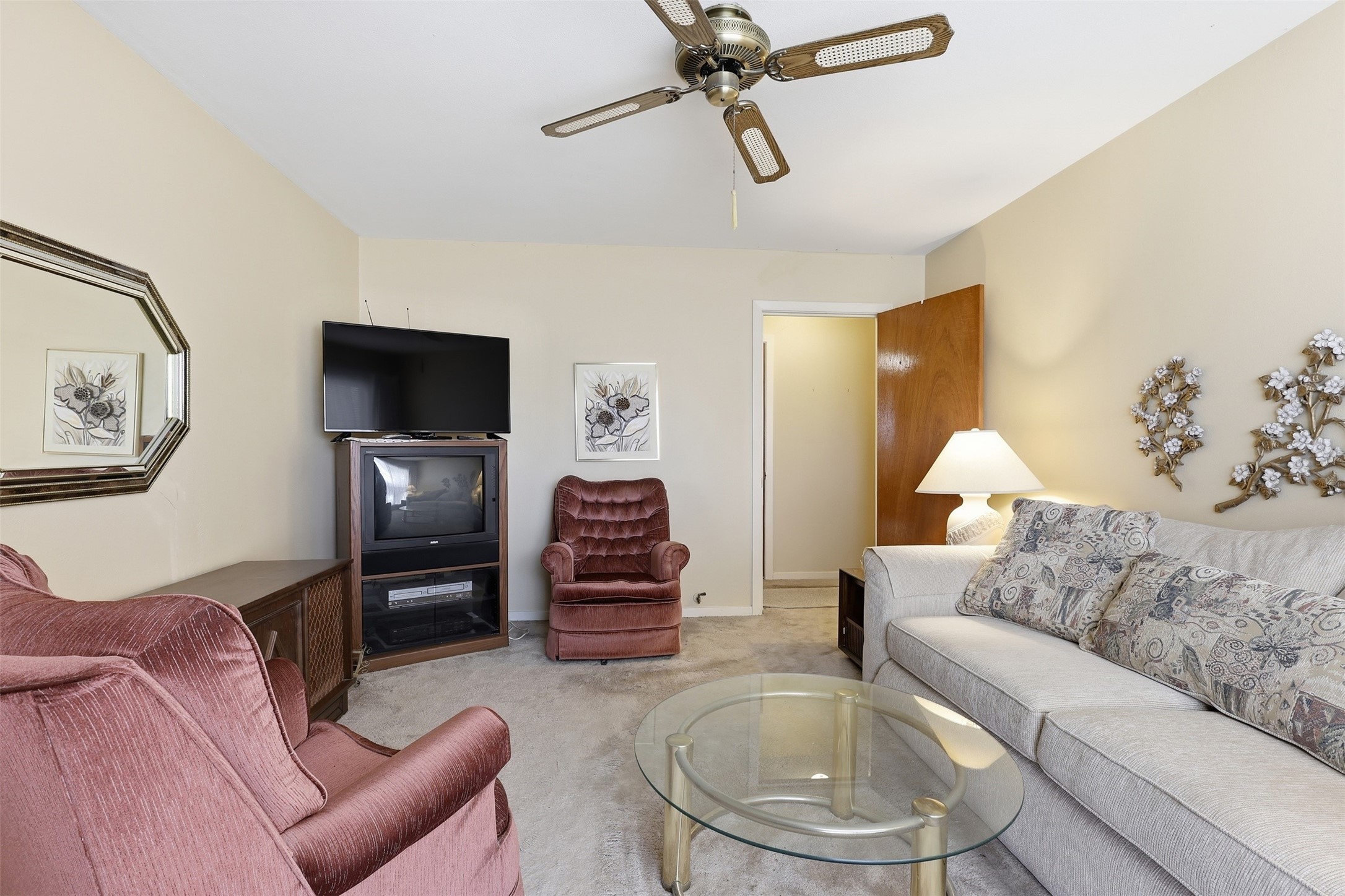 5707 Waltrip Street Houston, TX 77087 - Photo 4 of 15 Cozy living room featuring a ceiling fan creating a relaxing atmosphere.