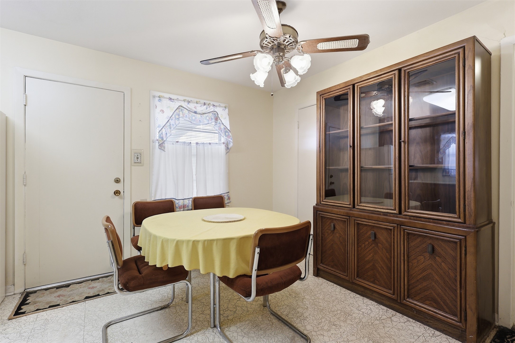 5707 Waltrip Street Houston, TX 77087 - Photo 8 of 15 A ceiling fan provides light and a window adds charm.