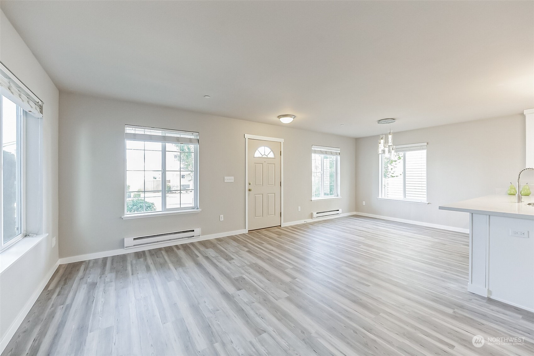 3077 Walker Road DuPont, WA 98327 - Photo 13 of 30 an empty room with wooden floor and windows
