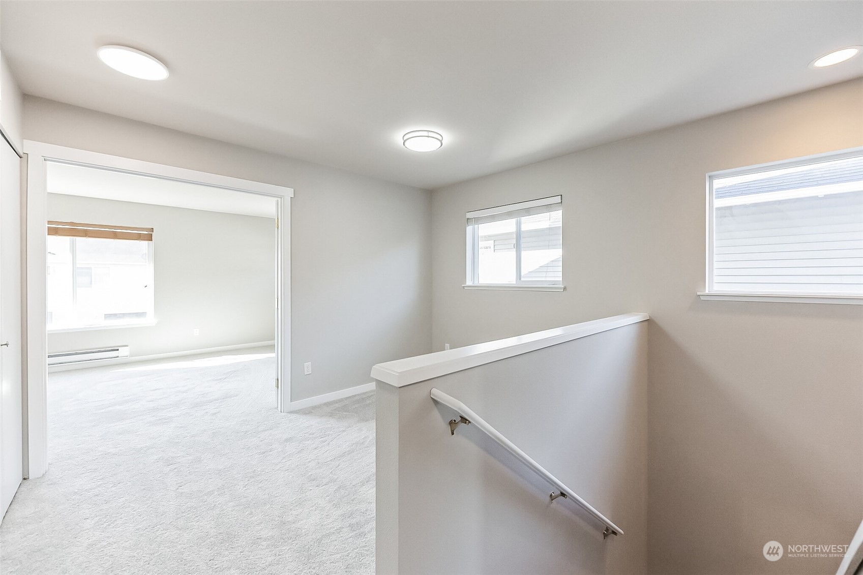 3077 Walker Road DuPont, WA 98327 - Photo 17 of 30 a view of an empty room with wooden floor and a window