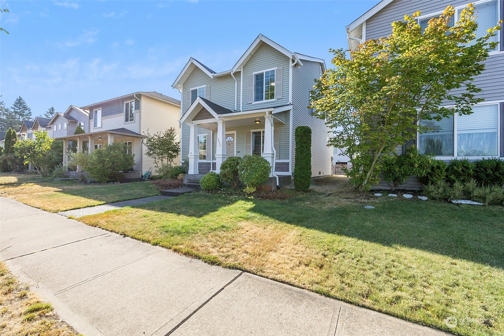 3077 Walker Road DuPont, WA 98327 - Photo 2 of 30 a front view of a house with garden
