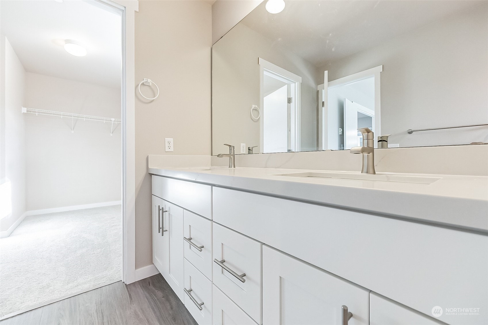 3077 Walker Road DuPont, WA 98327 - Photo 22 of 30 a bathroom with a sink and a mirror