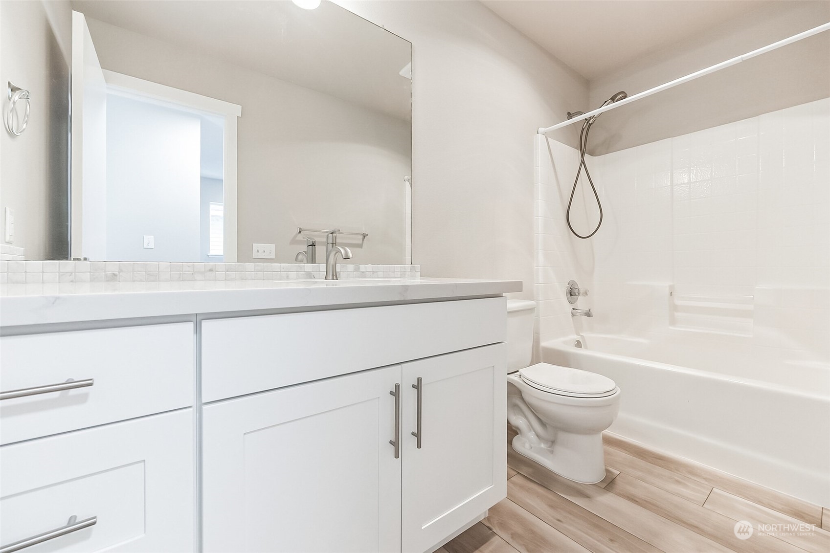 3077 Walker Road DuPont, WA 98327 - Photo 28 of 30 a bathroom with a sink toilet a mirror and shower