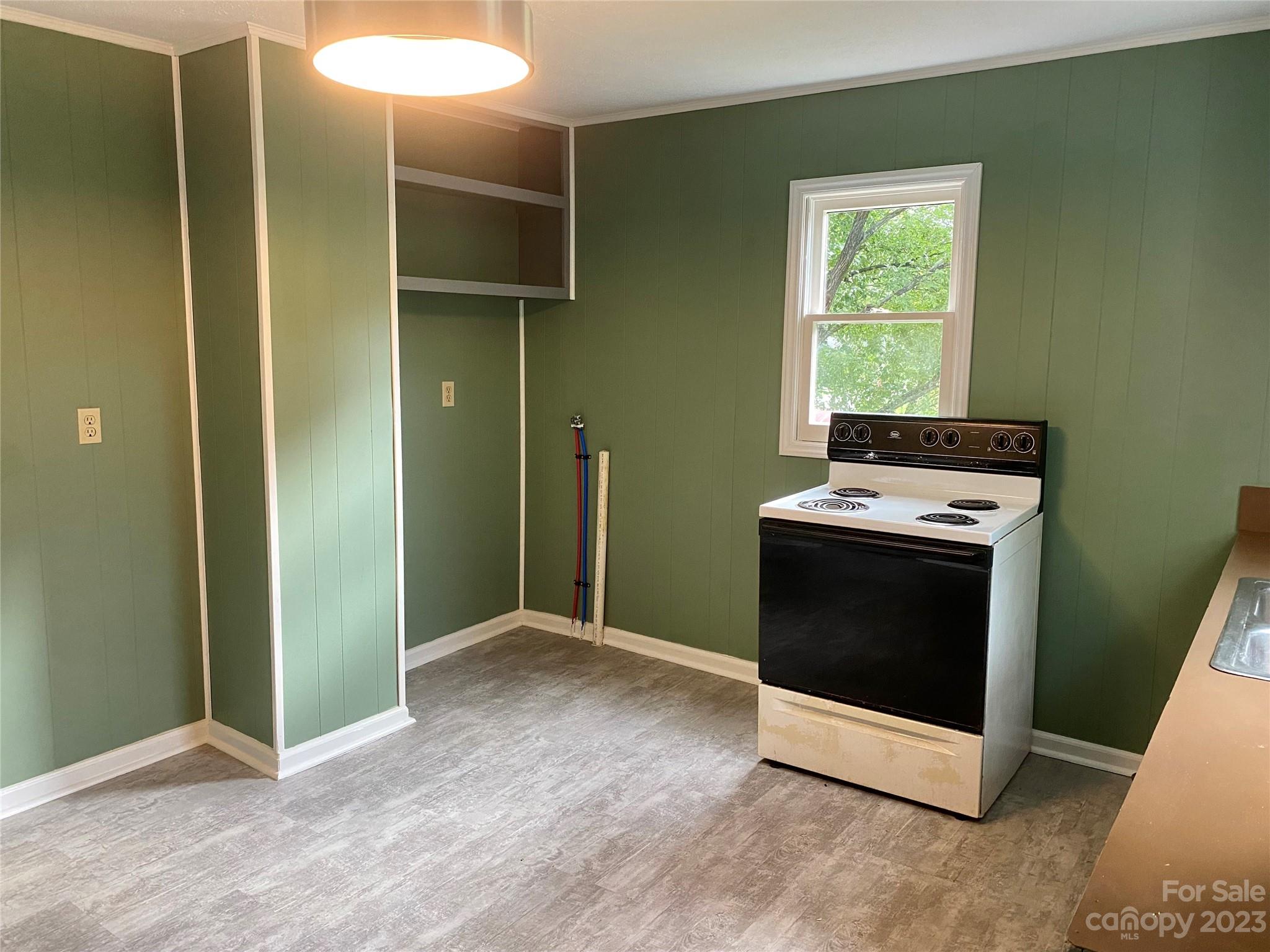 703 Stage Street Northwest Lenoir, NC 28645 - Photo 4 of 17 a view of an empty room with a fireplace and a window