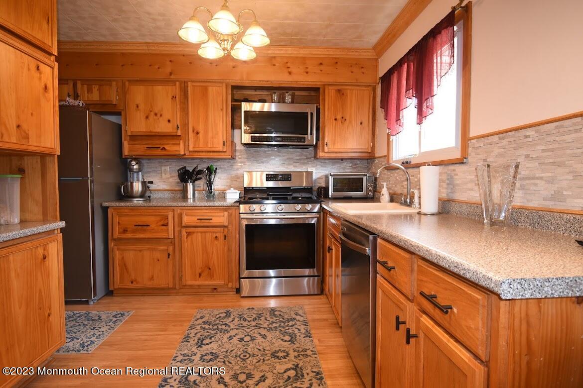 40 Alan Terrace Howell, NJ 07731 - Photo 13 of 48 a kitchen with a sink stove and microwave