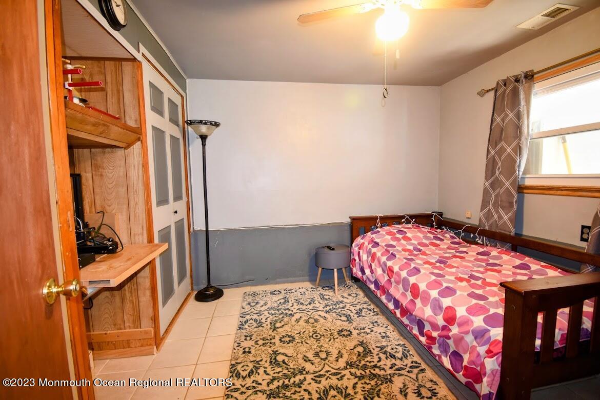 40 Alan Terrace Howell, NJ 07731 - Photo 28 of 48 a bedroom with a bed and a window