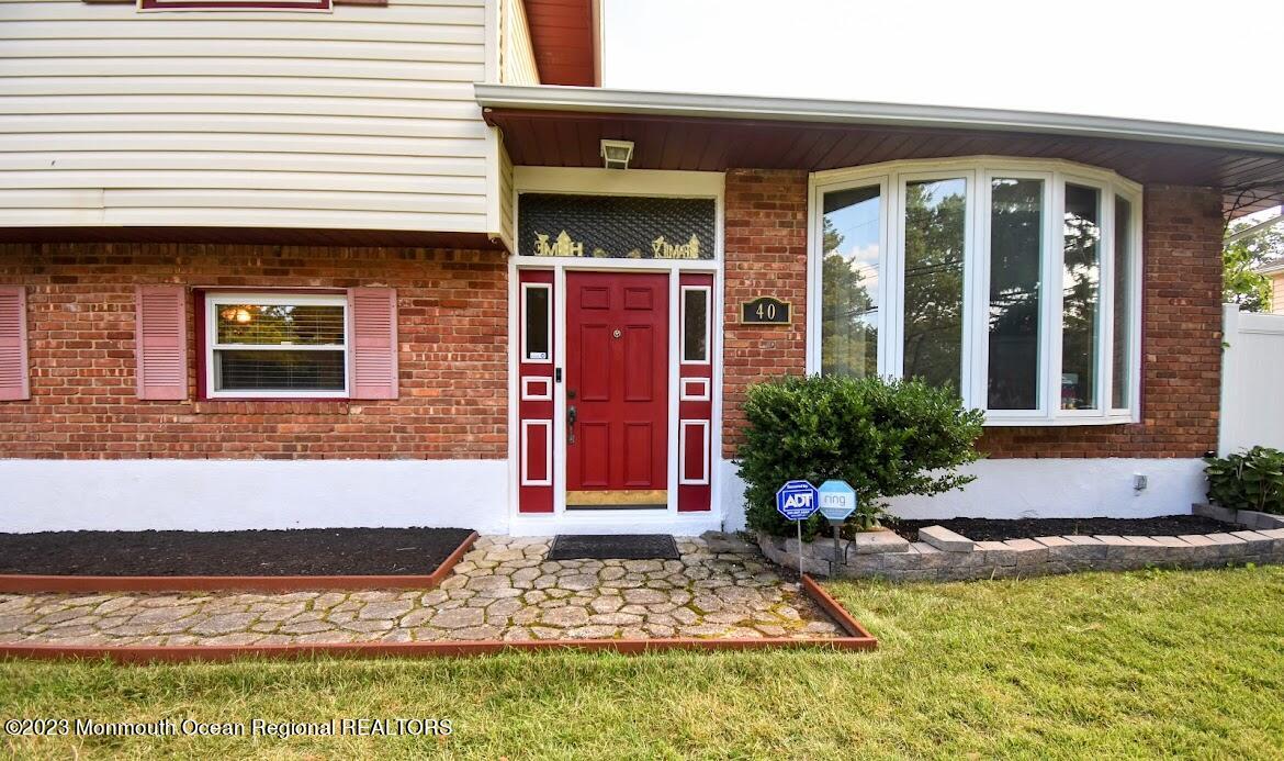 40 Alan Terrace Howell, NJ 07731 - Photo 3 of 48 a front view of a house with a yard
