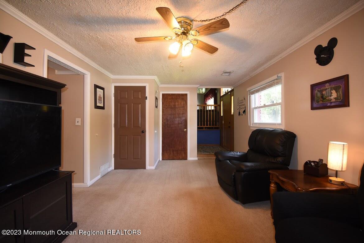 40 Alan Terrace Howell, NJ 07731 - Photo 34 of 48 a livingroom with workspace window and a ceiling fan